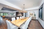 The custom dining table offers seating for 12, with additional seating available at the oversized kitchen island.